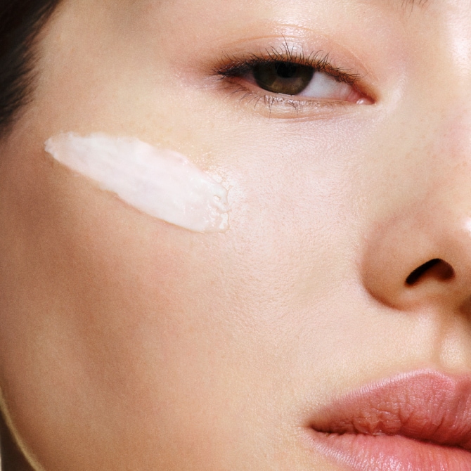 Model removing makeup with our gentle yet powerful Soothing Cleansing Oil